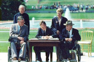 President Bush signing the Americans with Disabilities Act in 1990