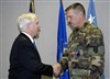 Defense Secretary Robert M. Gates pins the Bronze Star, Purple Heart and Combat Action Medal to Air Force Tech. Sgt. Michael Shumate at Whiteman Air Force Base, Mo., Nov. 20, 2007.  Shumate, an Explosive Ordinance Disposal Technician, received the medals for his efforts in Iraq.  