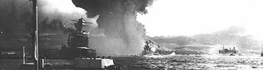 View down Battleship Row shows the listing USS California, the USS Maryland next to the capsized USS Oklahoma.