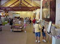 VISITORS VIEWING DISPLAYS AT CANYON VIEW PLAZA. THE GRAND CANYON NATIONAL PARK'S VISITOR AND INFORMATION CENTER. NPS PHOTO. 