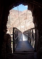 LOOKING NORTH ACROSS THE KAIBAB SUSPENSION BRIDGE OVER THE COLORADO RIVER IN GRAND CANYON N.P. MICHAEL ANDERSON, NPS. 