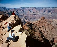 DAYHIKERS LOOKING OUT AT GRAND CANYON N.P. FROM OOH AAH POINT ON THE S KAIBAB TRAIL. NPS PHOTO. 