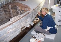 NPS CONSERVATOR CLEANING AND PRESERVING THE EDITH, (1911) ONE OF GRAND CANYON NATIONAL PARK'S HISTORIC COLORADO RIVER BOATS. BRYNN BENDER, NPS - WACC.