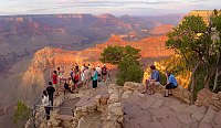 PARK VISITORS VIEWING SUNSET FROM YAVAPAI POINT ON THE S RIM OF GRAND CANYON NATIONAL PARK. NPS PHOTO.