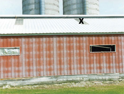 Figure 3. Fiberglass panel on metal roof (marked with an X).