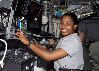 S121-E-07694 : Stephanie Wilson works with robotic controls