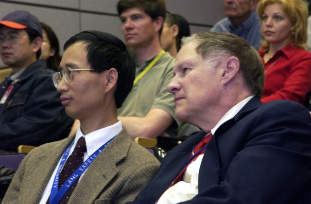 Yuntian Theodore Zhu  and Dean Peterson of Los Alamos' Superconductivity Technology Center (MST-STC) listen to comments at last Friday's cooperative research and development agreement signing in the MSL Auditorium.