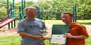 a picture of Mal Fordham receiving the Volunteer of the Year