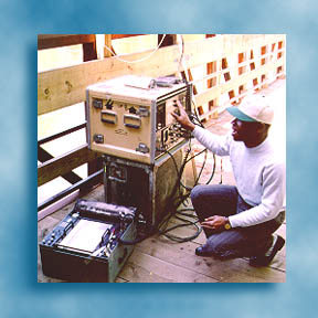 Geophysicist setting up ground penetrating radar equipment
