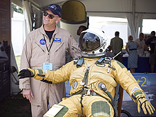 Dryden's Nils Larson shows a high altitude pressure suit, complete with a whiffle ball on the draw string