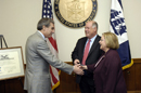 Secretary Gutierrez shakes hands with Under Secretary Glassman