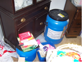 This picture shows barrels of Dextromethorphan and packaging materials for the drug.