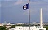 The State Department flag flies over the Washington monument and the U.S. Capitol during a reception commemorating the 50th anniversary of the Mutual Defense Agreement between the United States and the United Kingdom. U.S. Defense Secretary Robert M. Gates hosted the event in honor of U.K. Defense Minister Des Browne at the State Department, Washington, D.C., July 9, 2008.  