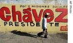A man walks by campaign mural for President Hugo Chavez in Maracaibo, in Venezuela's oil rich Zulia state, 1 Dec 2006