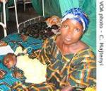 Mother and her baby wait for treatment for the baby's severe malaria at Cibitoke Hospital near Burundi's capital Bujumbura