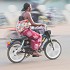 Women on motor bikes in Burkina Faso