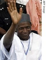 Leading candidate at the PDP presidential primary Umar Musa Yar'Adua waves to supporters at the Eagle Square venue of the convention in Abuja