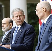President Bush, flanked by Federal Reserve Chairman Ben Bernanke, left, and Treasury Secretary Henry Paulson, delivers statement about economy, 19 Sep 2008