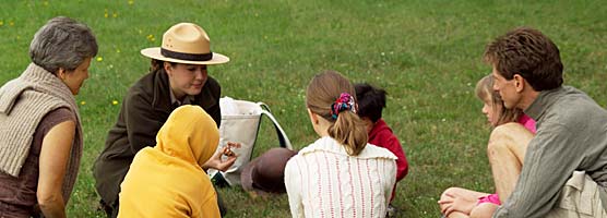 A park ranger helps kids learn about the different types and uses of copper.