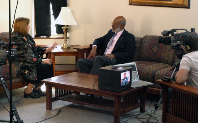 Carol Clark interviews Bill Phillips at University House for an edition of “Behind the White Coat.”