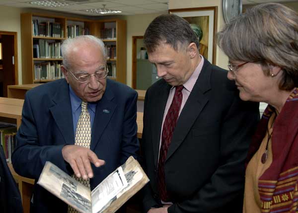 U.S. Ambassador to Israel views book during tour of Babylonian Jewish Heritage Center in Or-Yehuda, Israel. February 16, 2006. USEmbassy Tel Aviv photo.
