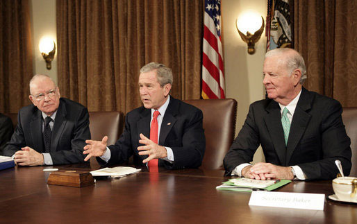 President George W. Bush addresses the press during a meeting with the Iraq Study Group in the Cabinet Room Wednesday, Dec. 6. 2006. Pictured with the President are the group's co-chairmen former Representative Lee Hamilton, left, and former Secretary of State James Baker.