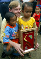 During his travel to Southeast Asia, Deputy Secretary Zoellick visited Banda Aceh and met with two young tsunami survivors. AP/Wide World photo