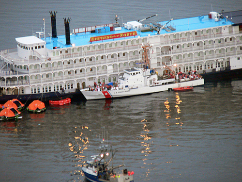 JUNEAU, Alaska (May 14, 2007)--Passengers from the Cruise Ship Empress of the North being offloaded onto the Coast Guard Cutter Liberty and civilian vessels after running aground.