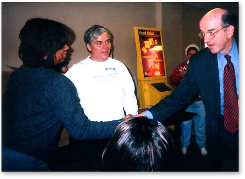 Tracey Mason, Executive Director of University Settlement, a social services center in Cleveland's Broadway neighborhood, welcomes Commissioner Copps with Kevin Cronin, Director Emeritus of Cleveland Digital Vision.