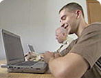 Soldier looking at a laptop