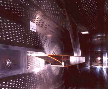 Photo of a hydrogen-fueled exhaust nozzle being tested in the 8- by 6-Foot Supersonic Wind Tunnel in support of an environmentally friendly, supersonic commercial transport.