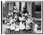 group of women on steps holding babies