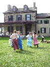 Children dancing on the lawn of Friendship Hill