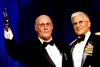 Time magazine journalist Michael Weisskopf, left, receives the Army's highest civilian award at the 2008 Army Birthday Ball in Washington, D.C., June 14, 2008. Weisskopf was embedded with the Army's 1st Armored Division in December 2008 when he lost his hand trying to dispose of an enemy grenade that landed in the Humvee in which he was riding. 
