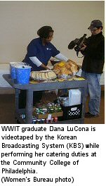 WWIT graduate Dana LuCona is videotaped by the Korean Broadcasting System (KBS) while performing her catering duties at the Community College of Philadelphia.