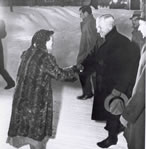 President Truman greeting neighbors in front of his home in Independence, 12/1948.