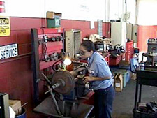 Image of Noemi, working on machinery