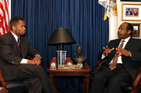 Paul Rusesabagina speaking with Congressman Jackson