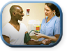 Female nurse taking male patient's blood pressure