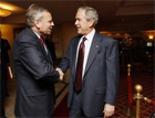 President George W. Bush greets NATO Secretary General Jaap de Hoop Scheffer, April 2, 2008, at the JW Marriott Bucharest Grand Hotel in Bucharest, site of the 2008 NATO Summit. [White House photo]