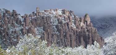 sunlight on snow coverd rock spires