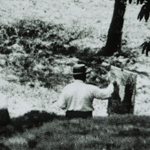 J. Alden Weir painting in a field on his Branchville farm.