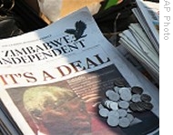 A pile of newspapers in Harare announcing deal between President Robert Mugabe and opposition leader Morgan Tsvangirai, 12 Sep 2008