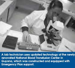 A lab technician uses updated technology at the newly renovated National Blood Transfusion Center in Guyana, which was constructed and equipped with Emergency Plan support.