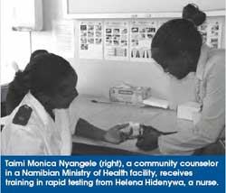 Taimi Monica Nyangele (right), a community counselor in a Namibian Ministry of Health facility, receives training in rapid testing from Helena Hidenywa, a nurse.