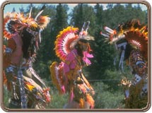 Tribemembers perform in traditional garb