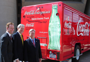 Dallas Mayor Tom Leppert, Regional Administrator Richard Greene join Coca-Cola Vice President Rick Gillis to unveil electric-hybrid delivery vehicles at Dallas City Hall.