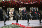 Commemorating the 60th Anniversary of the end of World War II, President George W. Bush and Laura Bush join world leaders in a wreath laying ceremony at the Tomb of the Unknown Soldier at the Kremlin Wall.