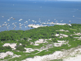 Aerial view of Sunken Forest, with Sailors Haven Marina and dozens of boats at anchor in the background.