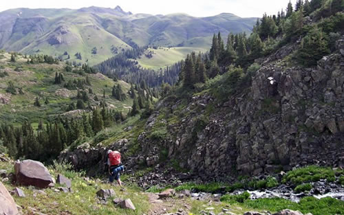 A backpacker on Highland Mary Trail, Columbine Ranger District. 